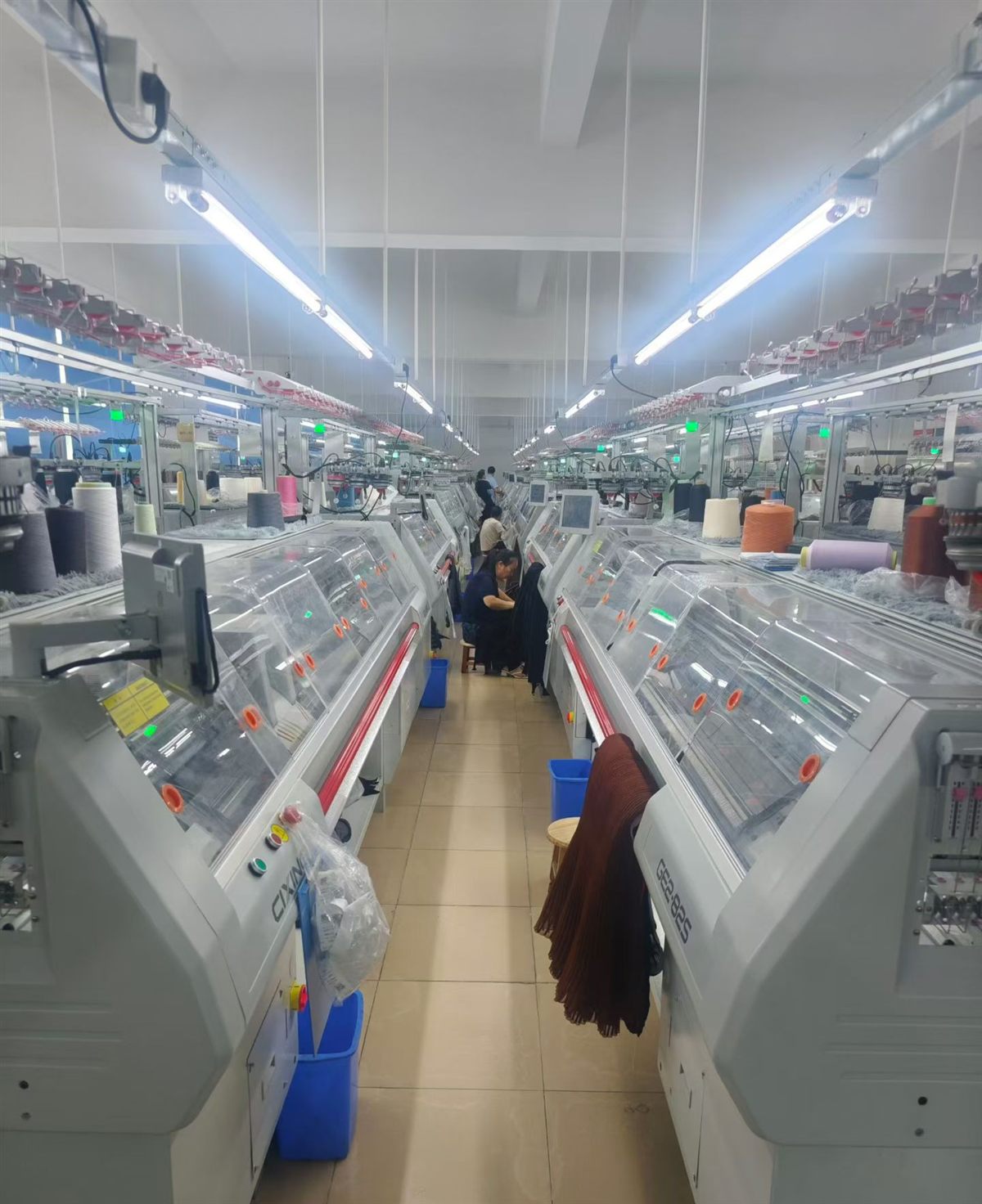 computerized flat knitting machines in a Dongguan sweater factory